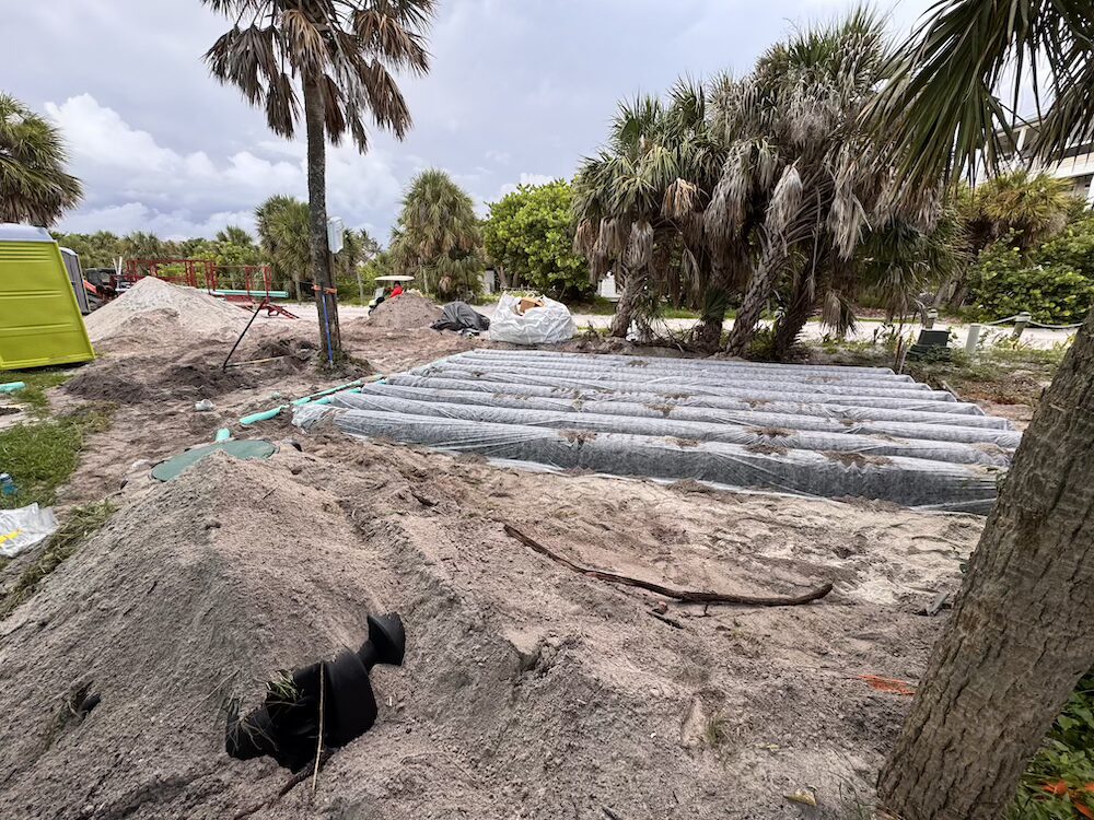Underground drain field pipes laid in sand during a residential septic service spring hill fl.